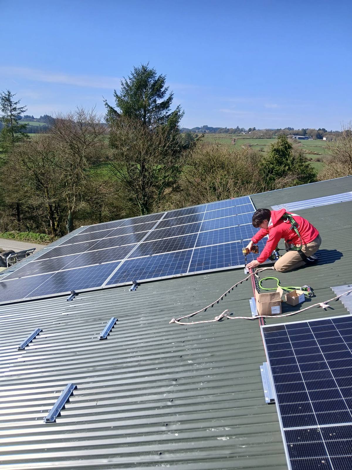 CTS Solar installer fitting solar panels on a farm shed roof in Co. Cork