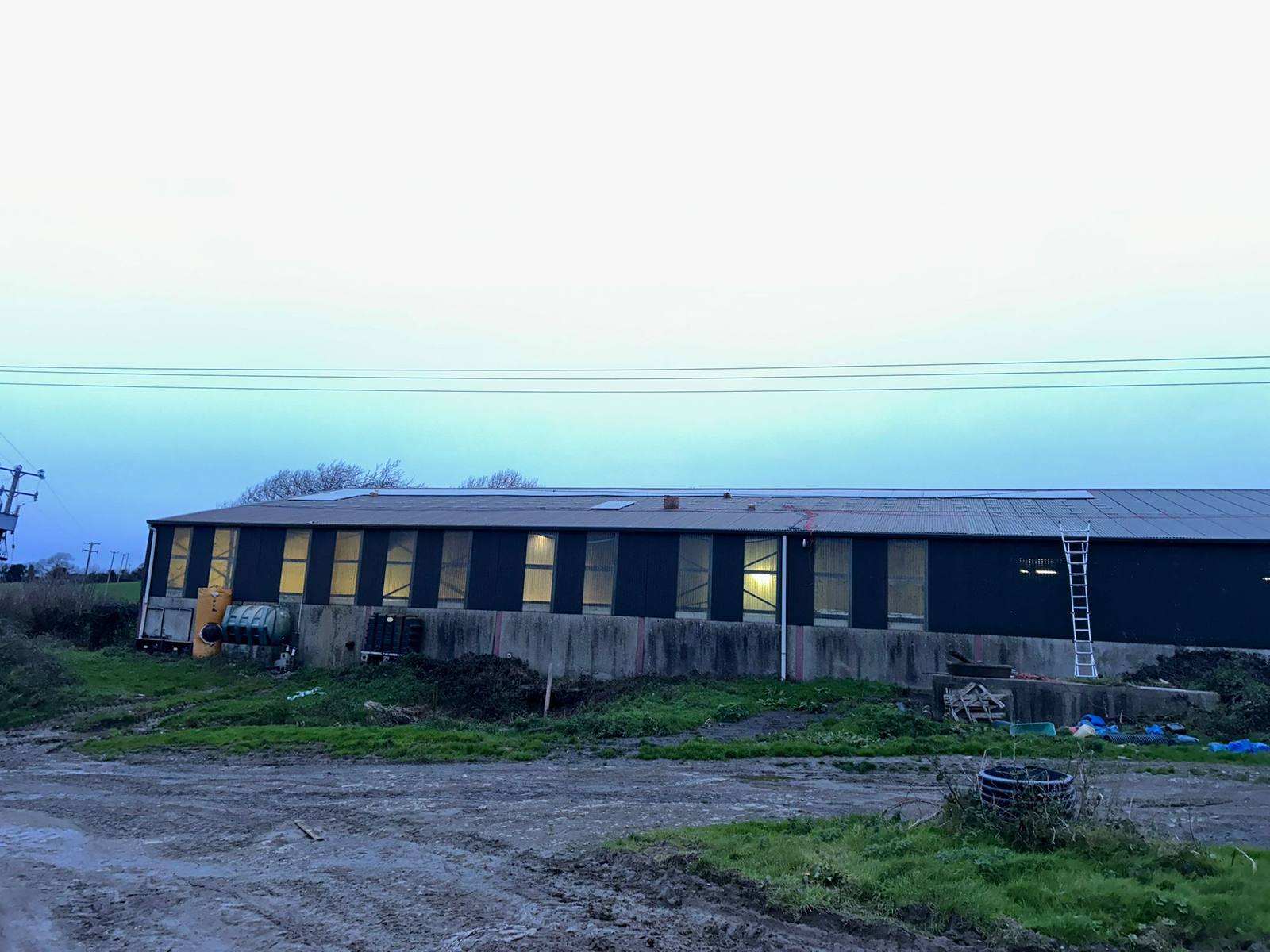 Finished farm solar install on a shed roof at dusk in Co. Cork, installed by CTS Solar