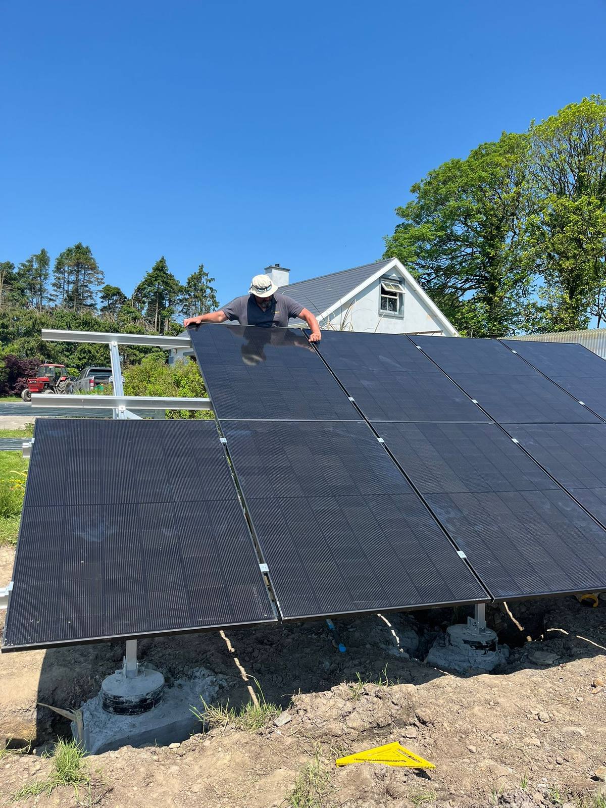 Crew fitting a ground-mount solar array beside a home in Co. Cork, installed by CTS Solar
